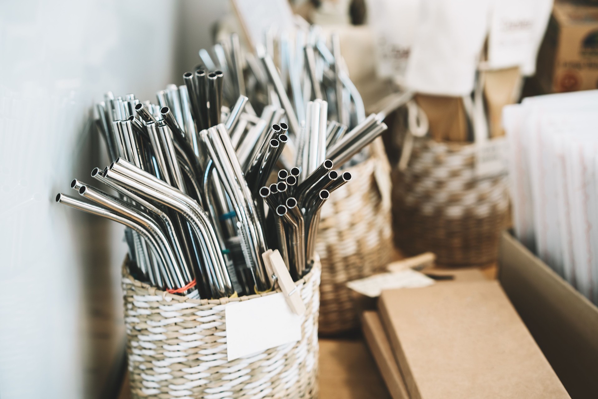 Metallic reusable straws in zero waste shop.